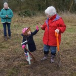 Deputy Mayor and little girl planting tree