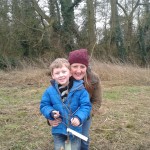 Local Mum and son planting a fruit tree